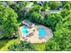 Inviting community pool with lounge chairs and ample space for relaxation, surrounded by lush greenery at 1099 Saratoga Cir, Carmel, IN 46280