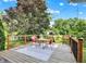 Picturesque deck with outdoor furniture, perfect for enjoying nature and tranquil backyard views at 1099 Saratoga Cir, Carmel, IN 46280