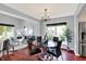 Open concept floorplan with dining room and views of the living room and stainless steel fridge at 1099 Saratoga Cir, Carmel, IN 46280