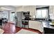 Updated kitchen features stainless steel appliances, white cabinetry, and ample counter space at 1099 Saratoga Cir, Carmel, IN 46280