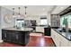 Modern kitchen with granite countertops, stainless steel appliances, and breakfast bar at 1099 Saratoga Cir, Carmel, IN 46280