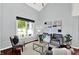 Bright living room with vaulted ceiling, stylish decor, and large windows offering plenty of natural light at 1099 Saratoga Cir, Carmel, IN 46280