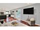 Bright living room features access to the kitchen and sun room at 1099 Saratoga Cir, Carmel, IN 46280