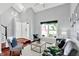 Living room features an open floor plan, vaulted ceilings, dark wood floors, and stylish decor at 1099 Saratoga Cir, Carmel, IN 46280
