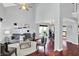 Spacious living room with vaulted ceiling, open floor plan, dark wood floors, and stylish decor at 1099 Saratoga Cir, Carmel, IN 46280