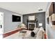 Bright living room features decorative fireplace, modern furnishings, and a TV at 1099 Saratoga Cir, Carmel, IN 46280