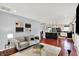 Cozy living room adjacent to kitchen, perfect for entertaining at 1099 Saratoga Cir, Carmel, IN 46280