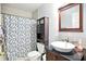 Compact bathroom featuring a vanity, toilet, and shower with floral curtain at 1106 Summer Way Ct, Shelbyville, IN 46176