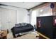 Cozy bedroom featuring a daybed, a PC, and a double-door closet at 1106 Summer Way Ct, Shelbyville, IN 46176