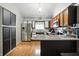 Well-lit kitchen featuring two-toned cabinets, stainless steel appliances, and durable countertops at 1106 Summer Way Ct, Shelbyville, IN 46176