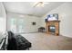 Bright living room featuring a cozy brick fireplace, vaulted ceilings and outdoor access at 1106 Summer Way Ct, Shelbyville, IN 46176