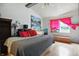 Well-lit primary bedroom with a vaulted ceiling, hardwood flooring, and a spacious layout at 1106 Summer Way Ct, Shelbyville, IN 46176