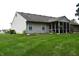 This home features a screened in porch, and a spacious yard at 1223 Long Shore Dr, Indianapolis, IN 46217