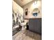 Cozy bathroom showcasing a toilet, grey vanity with a round mirror, and shower with curtain at 1223 Long Shore Dr, Indianapolis, IN 46217