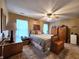 Spacious bedroom with a ceiling fan, warm lighting, and ample space for furnishings at 1223 Long Shore Dr, Indianapolis, IN 46217