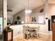 Cozy dining area featuring a round table, chair seating and natural lighting at 1223 Long Shore Dr, Indianapolis, IN 46217