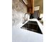 Modern kitchen sink area featuring stainless steel sink, sleek faucet, and ample counter space at 1223 Long Shore Dr, Indianapolis, IN 46217