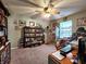 Well-lit home office with built-in bookshelves and a functional workspace setup at 1223 Long Shore Dr, Indianapolis, IN 46217