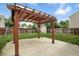 Backyard featuring a pergola, concrete patio, lawn, wooden fence, and small shed at 1236 N Aberdeen Dr, Franklin, IN 46131