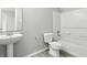 Bathroom featuring a pedestal sink, toilet and shower-tub combination at 1236 N Aberdeen Dr, Franklin, IN 46131