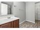 Bathroom with a sink, vanity, mirror, vinyl flooring, and a glass shower with a rack for towels at 1236 N Aberdeen Dr, Franklin, IN 46131