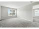 Bright bedroom features neutral walls and carpet, with two large windows for ample natural light at 1236 N Aberdeen Dr, Franklin, IN 46131