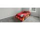 Bedroom decorated with a race car bed, carpet flooring, and a window with blinds at 1236 N Aberdeen Dr, Franklin, IN 46131