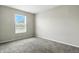 Bedroom featuring a window with horizontal blinds, carpet flooring, and neutral colored walls at 1236 N Aberdeen Dr, Franklin, IN 46131