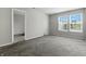 Bright bedroom features neutral walls and carpet, with two large windows for ample natural light at 1236 N Aberdeen Dr, Franklin, IN 46131