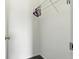 A small, empty closet with gray carpet and white walls featuring a shelf and hangers at 1236 N Aberdeen Dr, Franklin, IN 46131