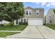 Inviting two-story home with a well-maintained lawn and a two-car garage at 1236 N Aberdeen Dr, Franklin, IN 46131