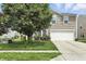 Inviting two-story home with a well-maintained lawn and a two-car garage at 1236 N Aberdeen Dr, Franklin, IN 46131
