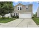 Inviting two-story home with a well-maintained lawn and a two-car garage at 1236 N Aberdeen Dr, Franklin, IN 46131