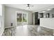 Open living room with sliding glass doors to backyard and hardwood-style floors at 1236 N Aberdeen Dr, Franklin, IN 46131
