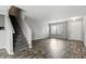 Light-filled living room with staircase and entry door at 1236 N Aberdeen Dr, Franklin, IN 46131
