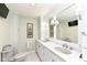 Well lit bathroom with double sinks, large mirrors, and decorative cabinets with lots of storage space at 1237 Driftwood Dr, Carmel, IN 46033