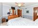 Traditional bedroom with a ceiling fan, TV, and wood dresser at 1237 Driftwood Dr, Carmel, IN 46033