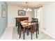 Dining room with window, hardwood floors, and a four seat dining table at 1237 Driftwood Dr, Carmel, IN 46033