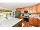 Modern kitchen showcasing stainless appliances, tile backsplash, and quartz countertops at 1237 Driftwood Dr, Carmel, IN 46033