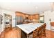 Bright kitchen featuring a large center island with seating and modern stainless steel appliances at 1237 Driftwood Dr, Carmel, IN 46033