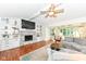 Inviting living room featuring a fireplace, built-in shelving, and comfortable seating area at 1237 Driftwood Dr, Carmel, IN 46033