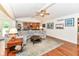 Open floor plan with living room, hardwood flooring, and view of kitchen and backyard at 1237 Driftwood Dr, Carmel, IN 46033