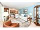 Comfortable living room offering hardwood floors, white furniture, and traditional decor at 1237 Driftwood Dr, Carmel, IN 46033