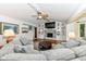 Spacious living room featuring a fireplace, built-in shelves, and hardwood flooring at 1237 Driftwood Dr, Carmel, IN 46033