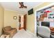 Office room with a work desk, ample storage shelving and chair, across from an open bathroom at 1237 Driftwood Dr, Carmel, IN 46033
