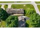 Aerial view shows the back of the home featuring a large deck and trees at 136 W Loretta Dr, Indianapolis, IN 46217