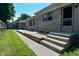 Backyard view featuring the wood deck, storage shed, and stone house exterior at 136 W Loretta Dr, Indianapolis, IN 46217
