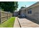 Backyard with a storage shed, wood deck, and landscaped yard at 136 W Loretta Dr, Indianapolis, IN 46217