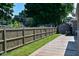 Fenced backyard with a shed and wood deck at 136 W Loretta Dr, Indianapolis, IN 46217