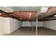 Unfinished basement with painted walls and exposed ceiling beams at 136 W Loretta Dr, Indianapolis, IN 46217